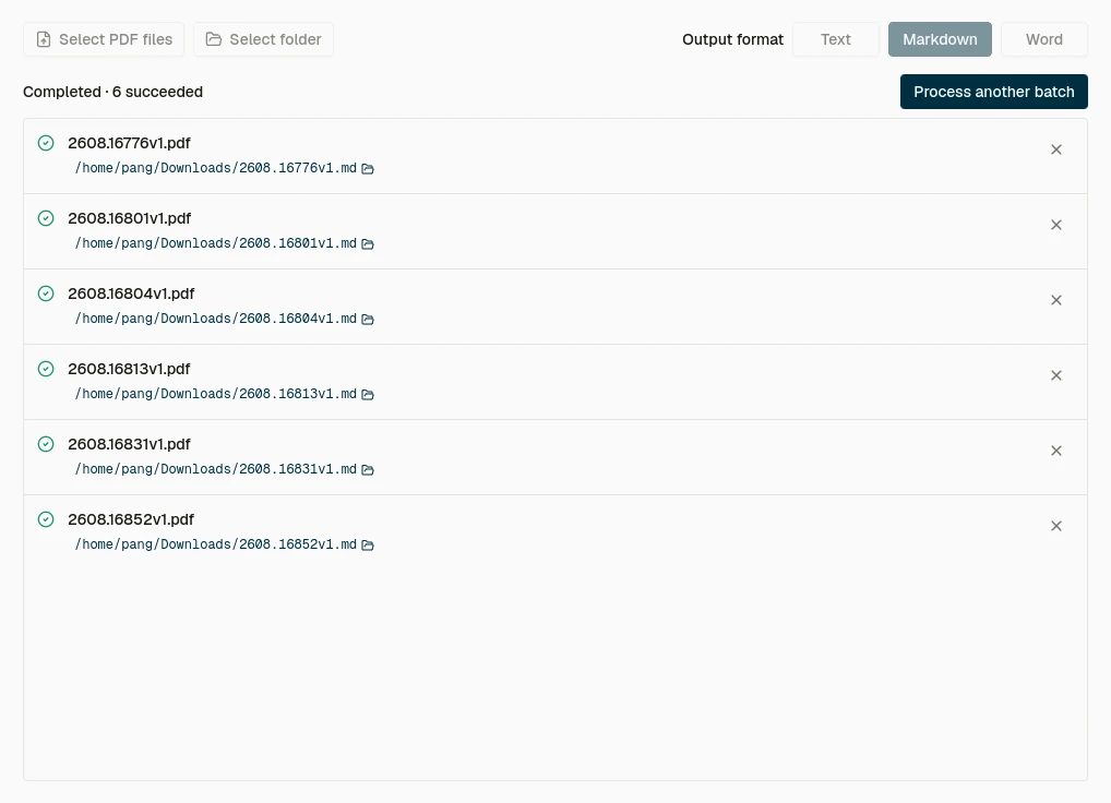Every completed PDF is saved as a separate .md file with its output path shown in the queue.